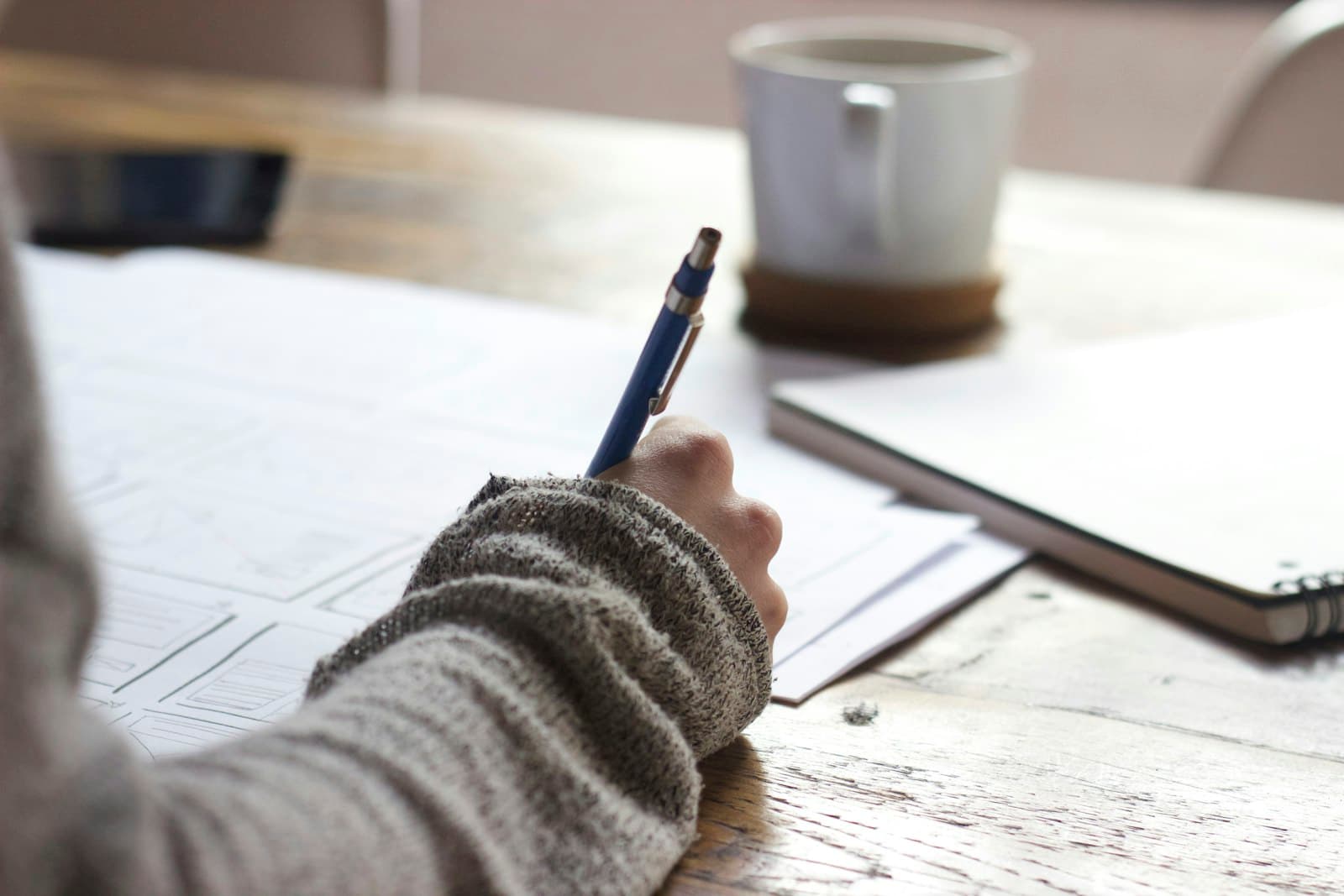 Training plan notes beside a laptop