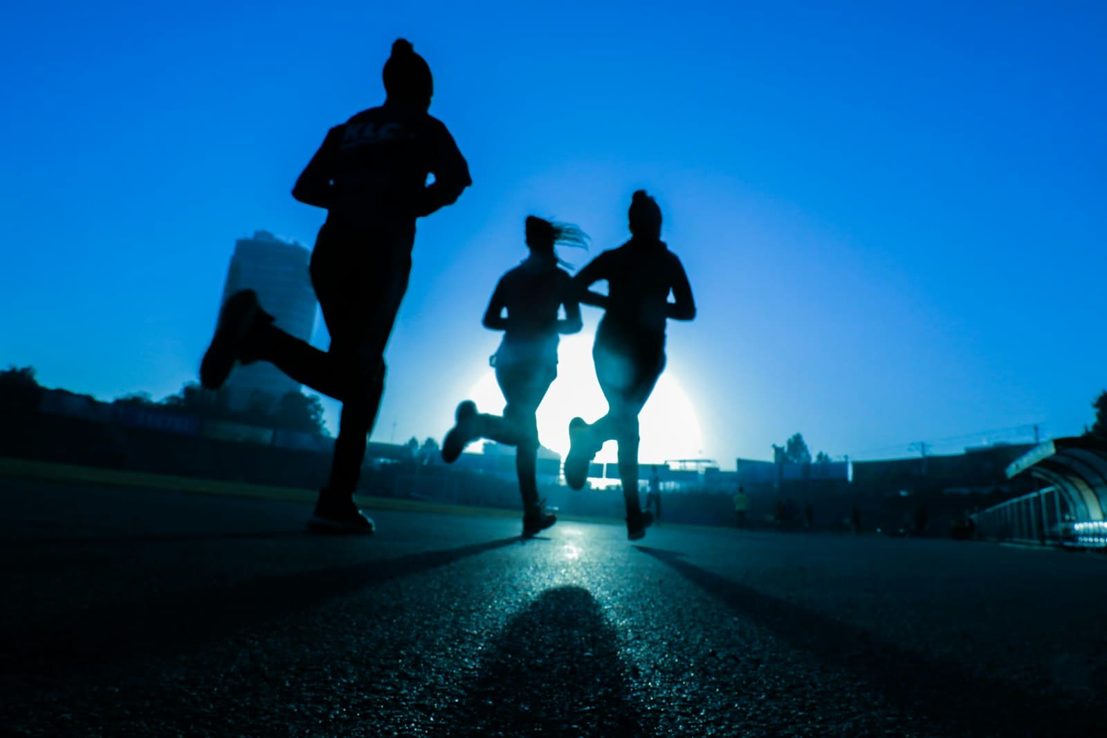 Runner at sunrise pacing an easy effort